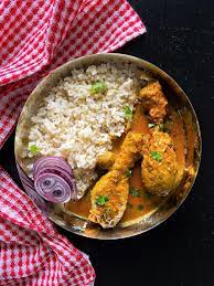 Murgir Jhol (Curry) or Bengali Chicken Curry with steamed rice
