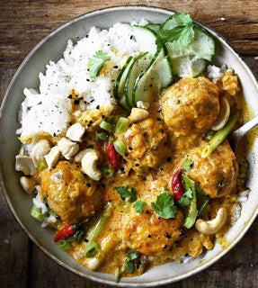 Jamaican Chicken Meatball Curry, served with Cucumber, Cashew, Cilantro, Nigella seed salad and Steamed Rice