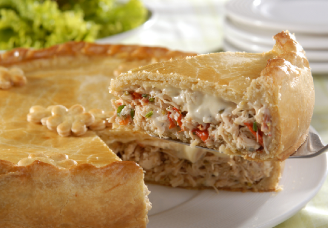 Empadão goiano or Brazilian meat pie with a side salad