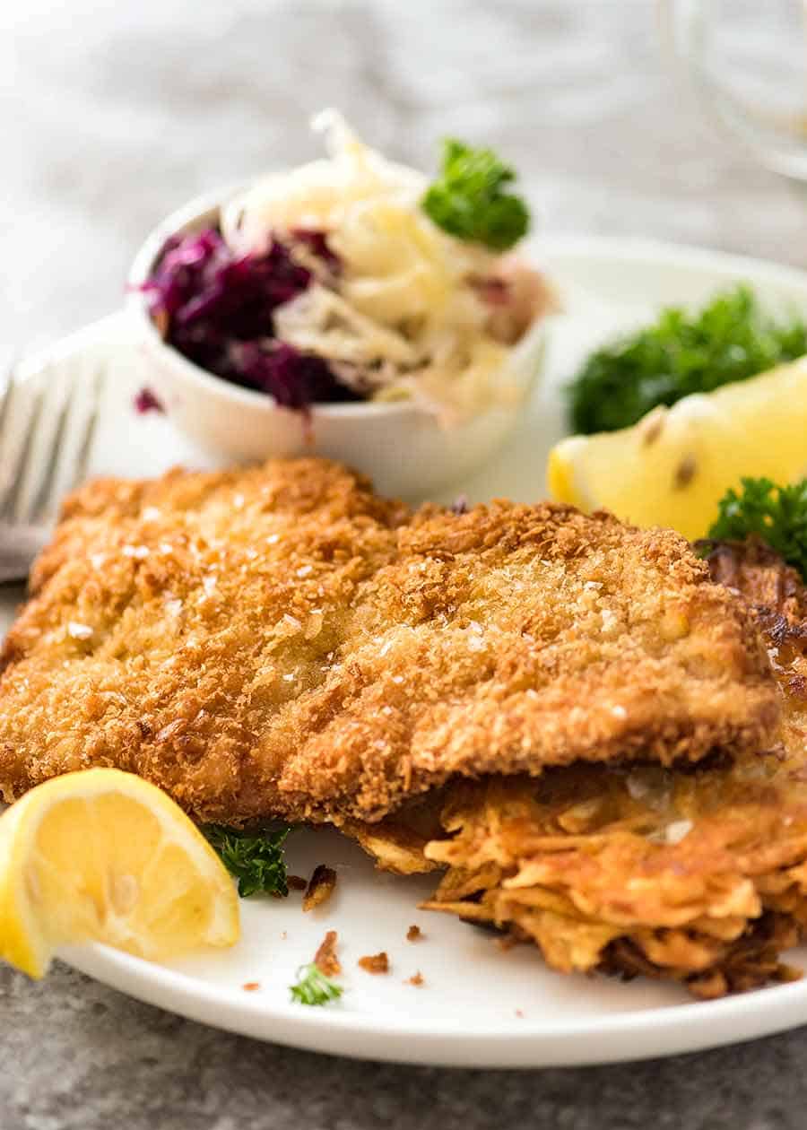 German Pork (or Chicken) Schnitzel with potato bacon salad and cabbage, fennel,  apple slaw