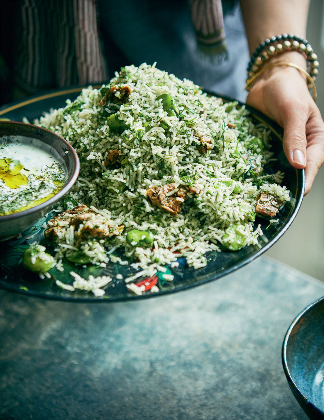 Iraqi Timman Bagilla or Green Rice with fava beans, dill, and lamb with a yogurt mint sauce